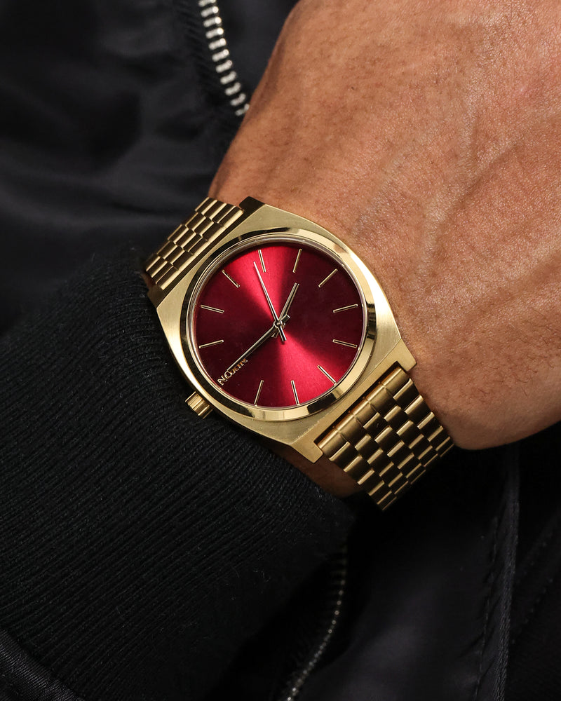 Nixon gold store watch red face